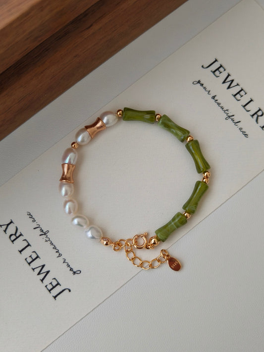 natural pearl mix with green resin, the bamboo shape resin represents life is getting better, the asymmetric design made this bracelet unique