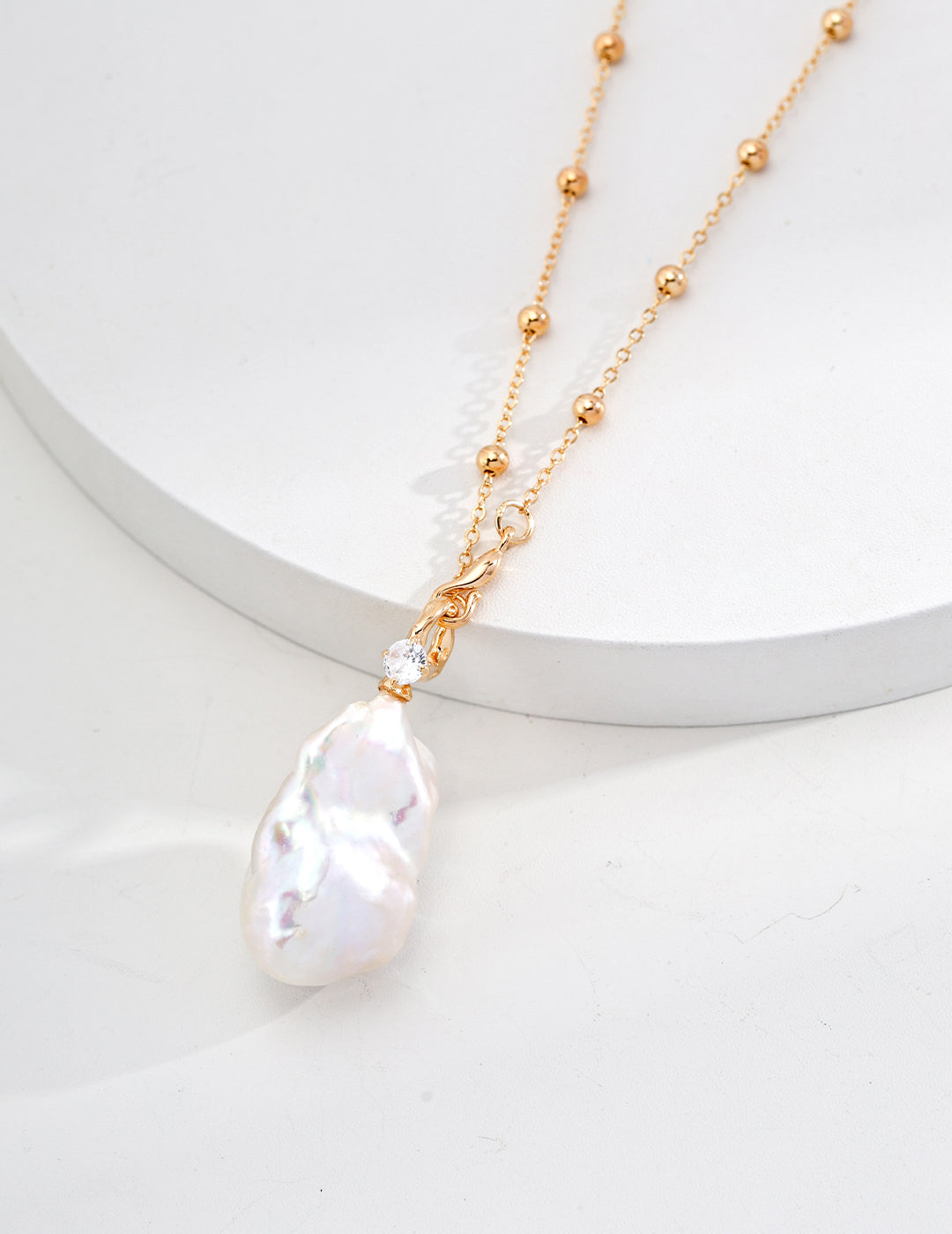 large baroque pearl pendant on a long chain, each baroque pearl is one of a kind, made it special for you. the necklace is 18k gold plated sterling silver, 50cm+6cm long, perfect for wear it solo or layering.