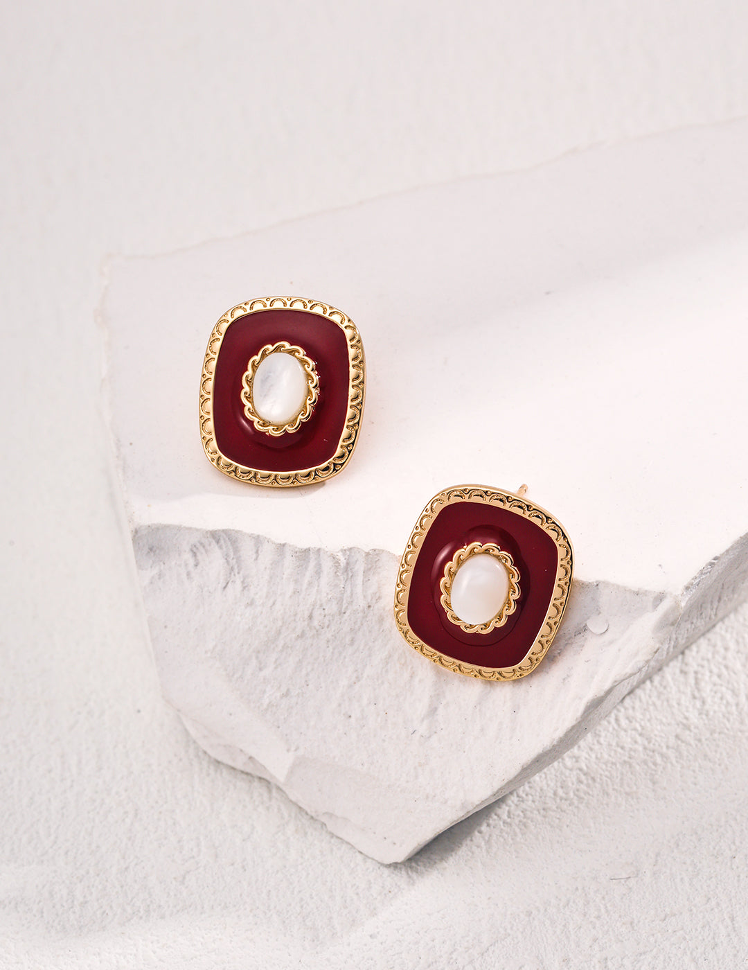 white shell surrounded with burgundy red drip glaze and delicate craftings, these square shape studs bring you a warm, elegant french style in this winter