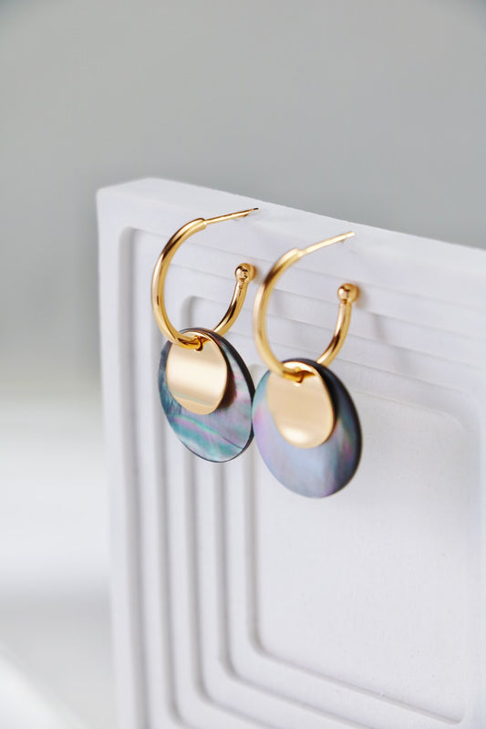 Grey shell earrings reflecting glorious light, the minimalist designed hoods are perfect for your everyday outfits